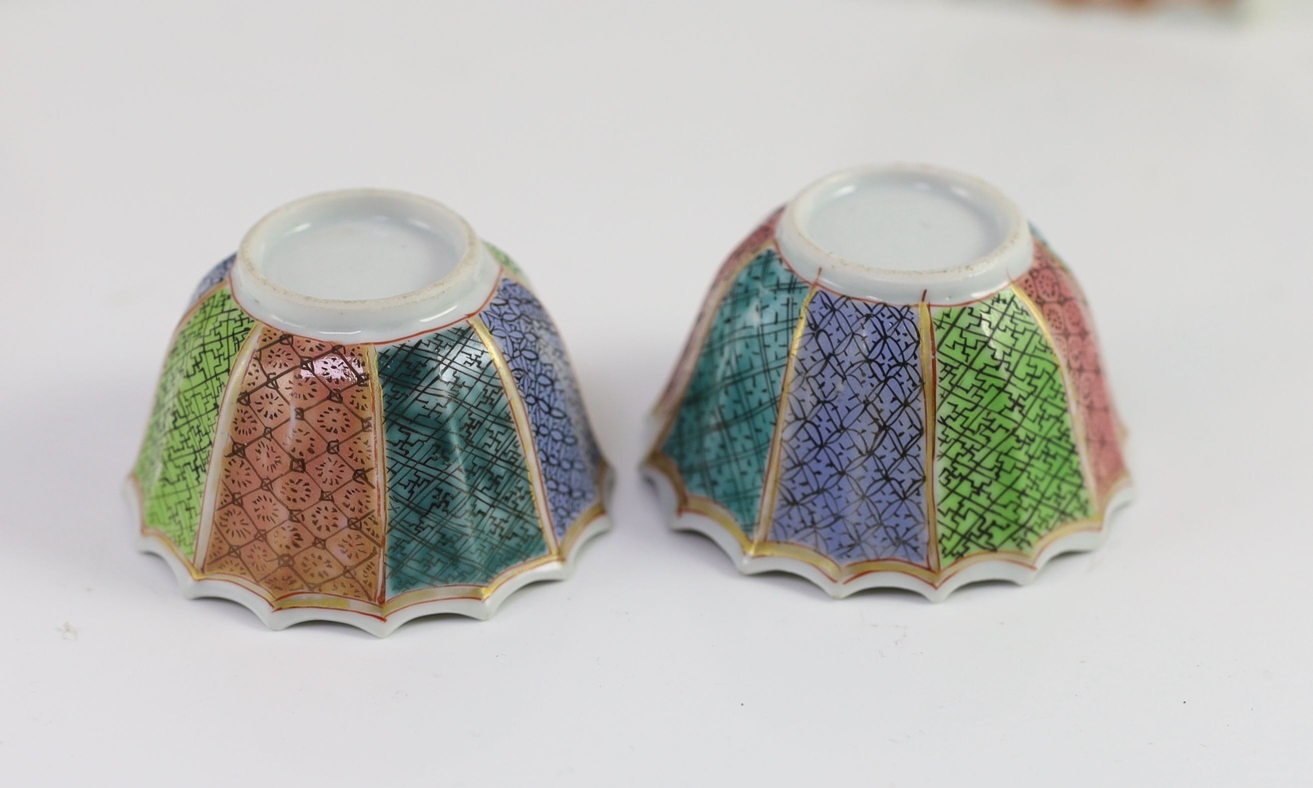 A pair of Chinese famille rose petal fluted tea bowls and saucers, Yongzheng period, saucer 10.5cm diameter
